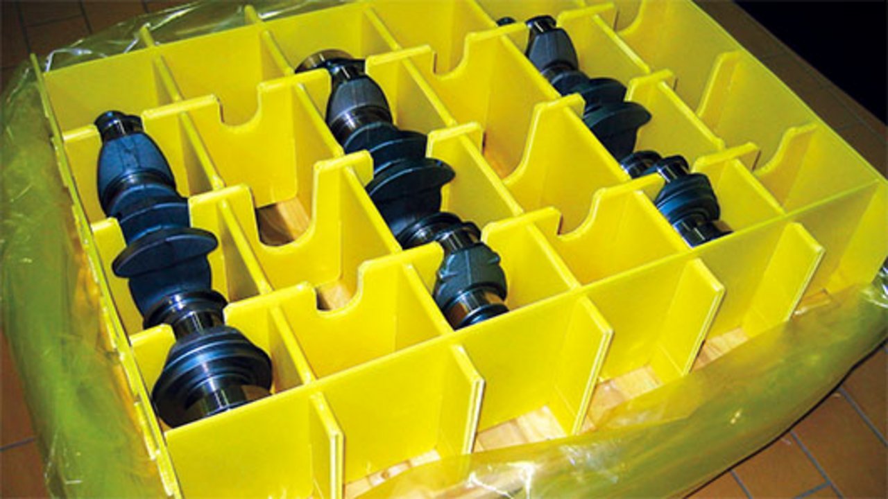 Metal parts packed in a box lined with ICB film