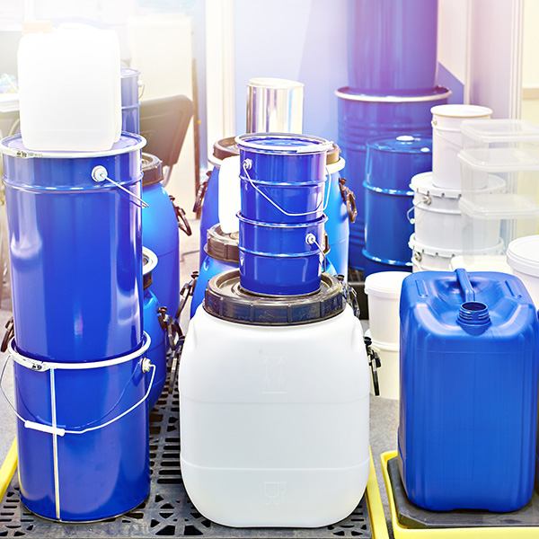 Lurigol Additive Application Lurigol Additive in canisters, next to metal cans