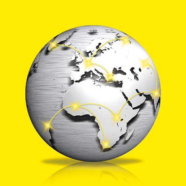 Joint venture metal globe Metal globe against a yellow background with marked locations of the joint venture